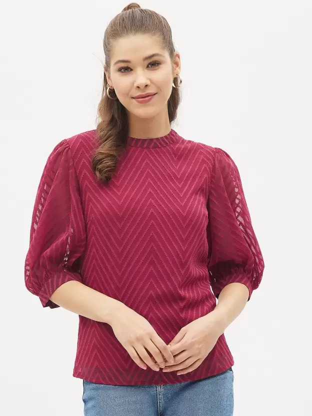 Elevate your wardrobe with our elegant maroon top. This versatile piece is perfect for both casual and formal occasions. Its rich, deep hue adds a touch of sophistication to any outfit.